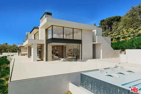 a view of a house with large windows