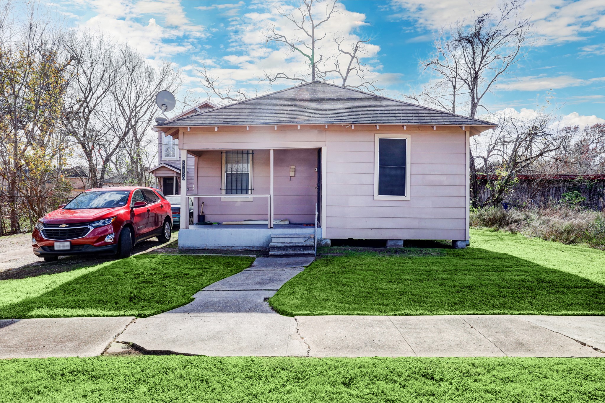 3230 Bremond Street Houston, TX 77004 - Photo 4 of 10 a front view of a house with a garden