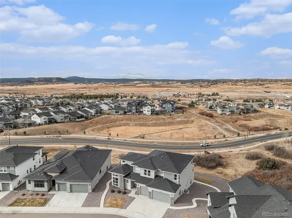 an aerial view of residential building and ocean view
