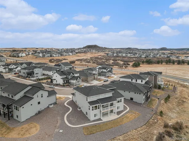 an aerial view of residential houses with outdoor space