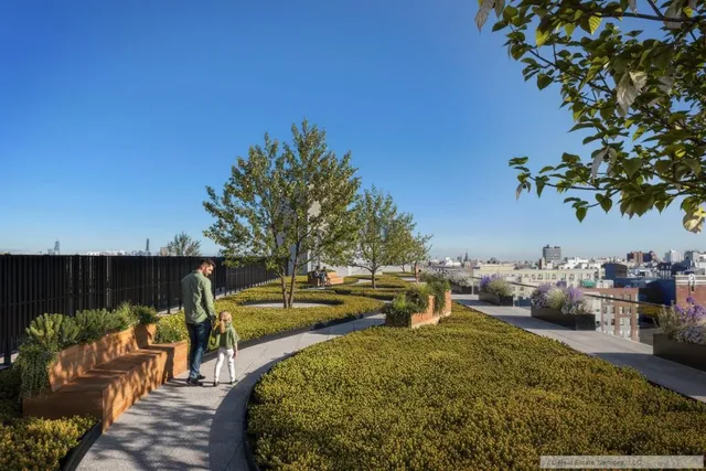 a view of swimming pool with outdoor seating and plants