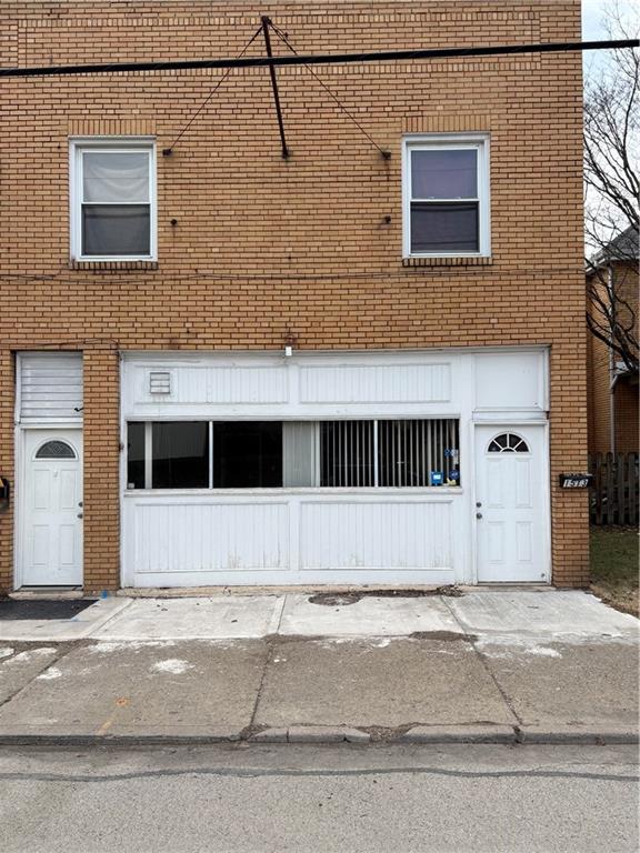 1513 Duss Avenue, Unit 1 Ambridge, PA 15003 - Photo 1 of 12 a view of a building with a street