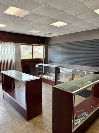 a kitchen with stainless steel appliances granite countertop a sink and a microwave