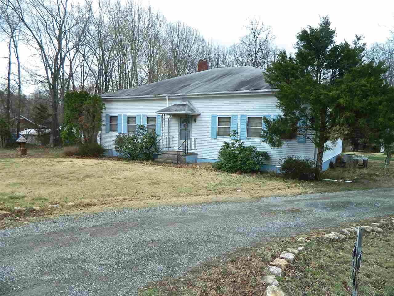 2940 Courthouse Road Louisa, VA 23093 - Photo 1 of 4 a view of a house next to a yard with plants and trees