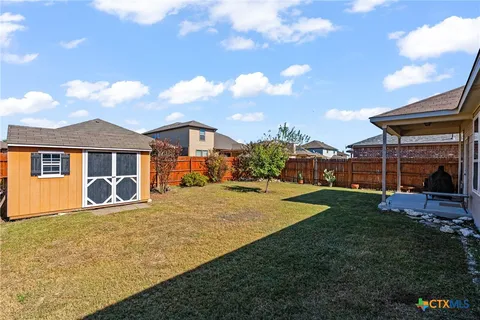 a view of a yard in front of a house