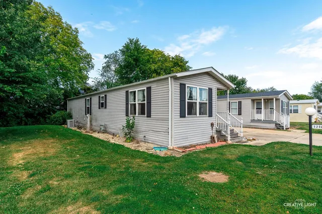 a front view of house with a garden and patio