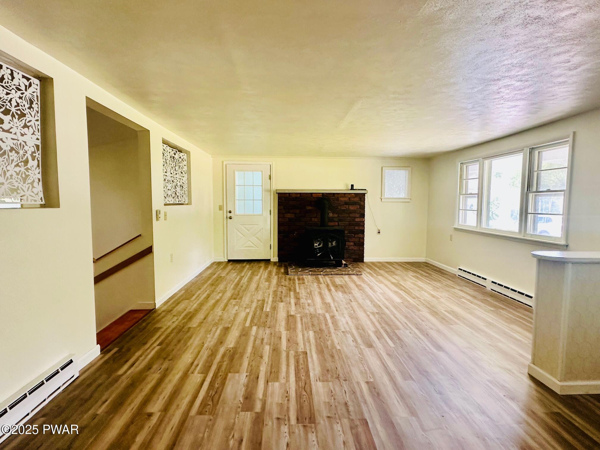 191 Hemlock Grove Road Greentown, PA 18426 - Photo 10 of 31 a view of empty room with wooden floor