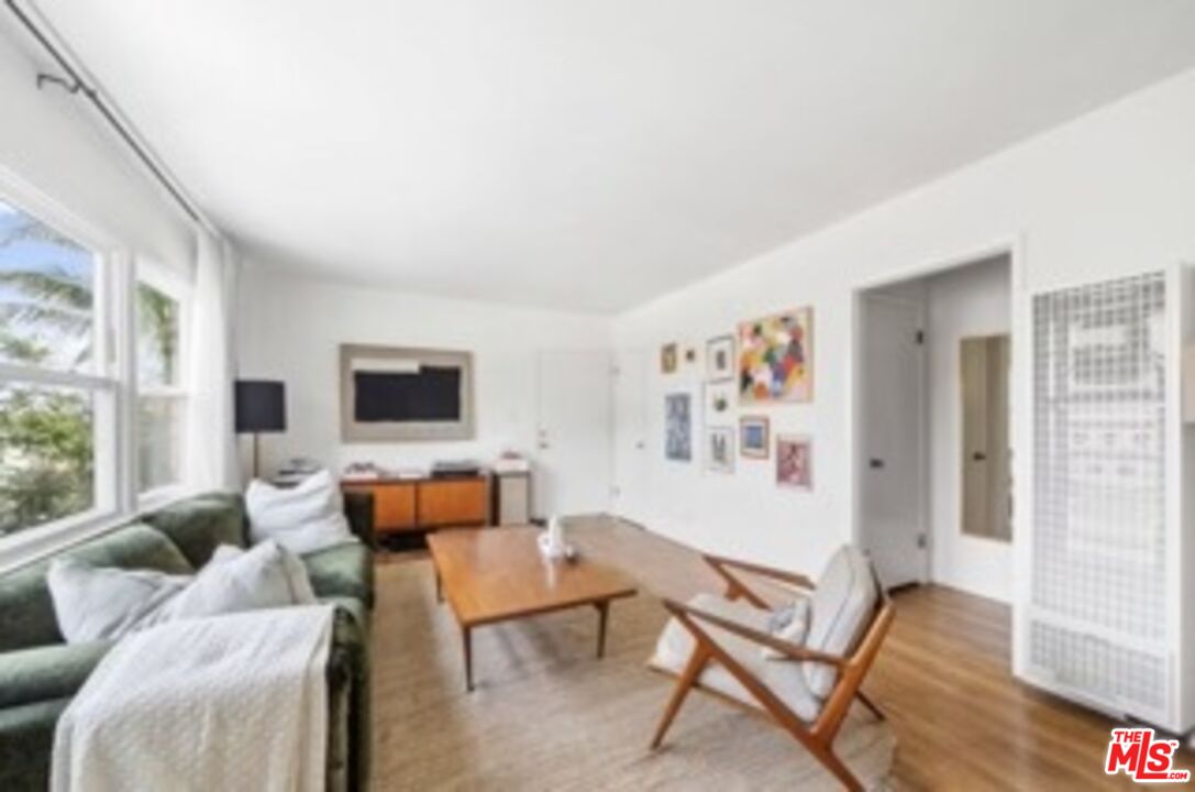 247 3rd Avenue Venice, CA 90291 - Photo 3 of 12 a living room with furniture and a flat screen tv