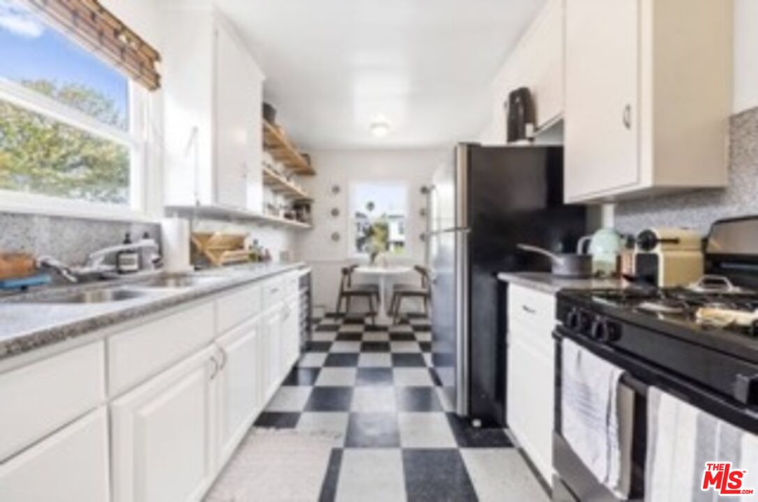 247 3rd Avenue Venice, CA 90291 - Photo 5 of 12 a kitchen with sink cabinets and appliances