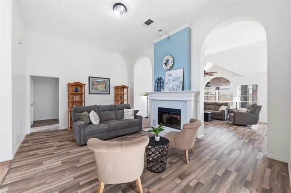 a living room with furniture and a fireplace