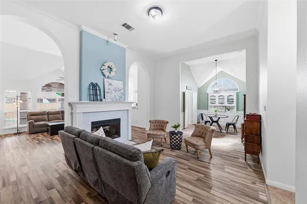 a living room with furniture or couch and a fireplace