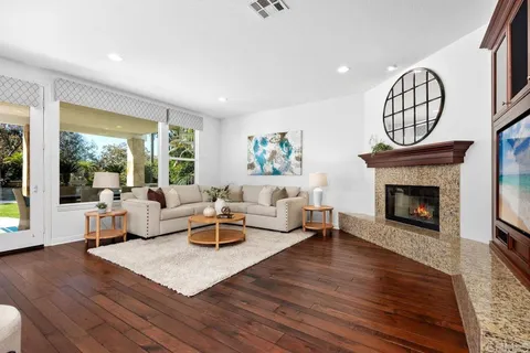 a kitchen with stainless steel appliances kitchen island granite countertop a sink and cabinets