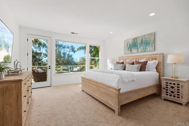 a bathroom with a granite countertop sink mirror and shower