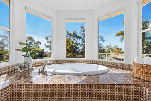 a view of a workspace with furniture and wooden floor