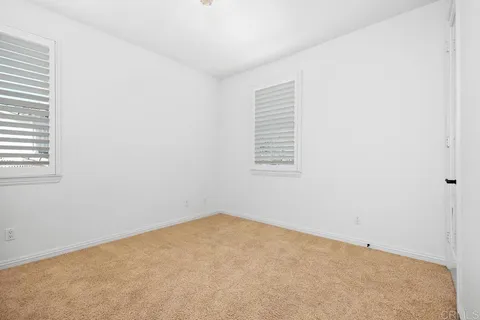 a view of a kitchen with a stove and a wooden floor