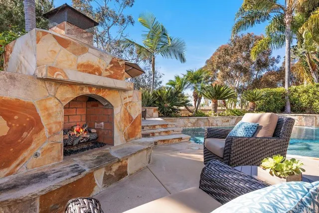 a view of a swimming pool with a yard