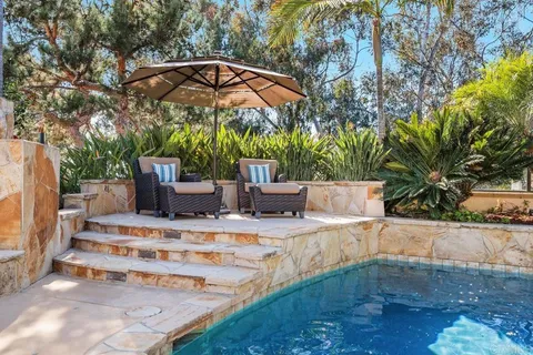 an aerial view of residential house with outdoor space and river view