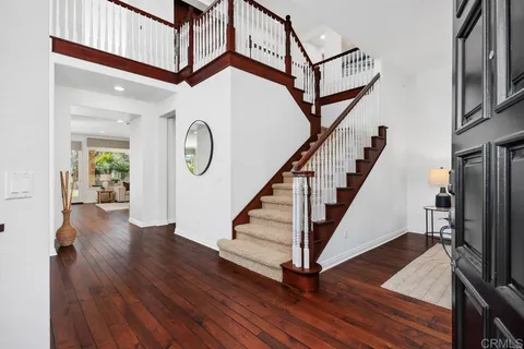 a view of entryway with wooden floor