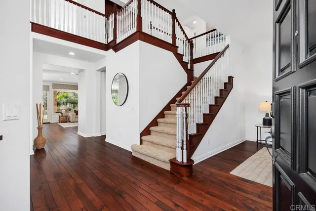 a view of entryway with wooden floor