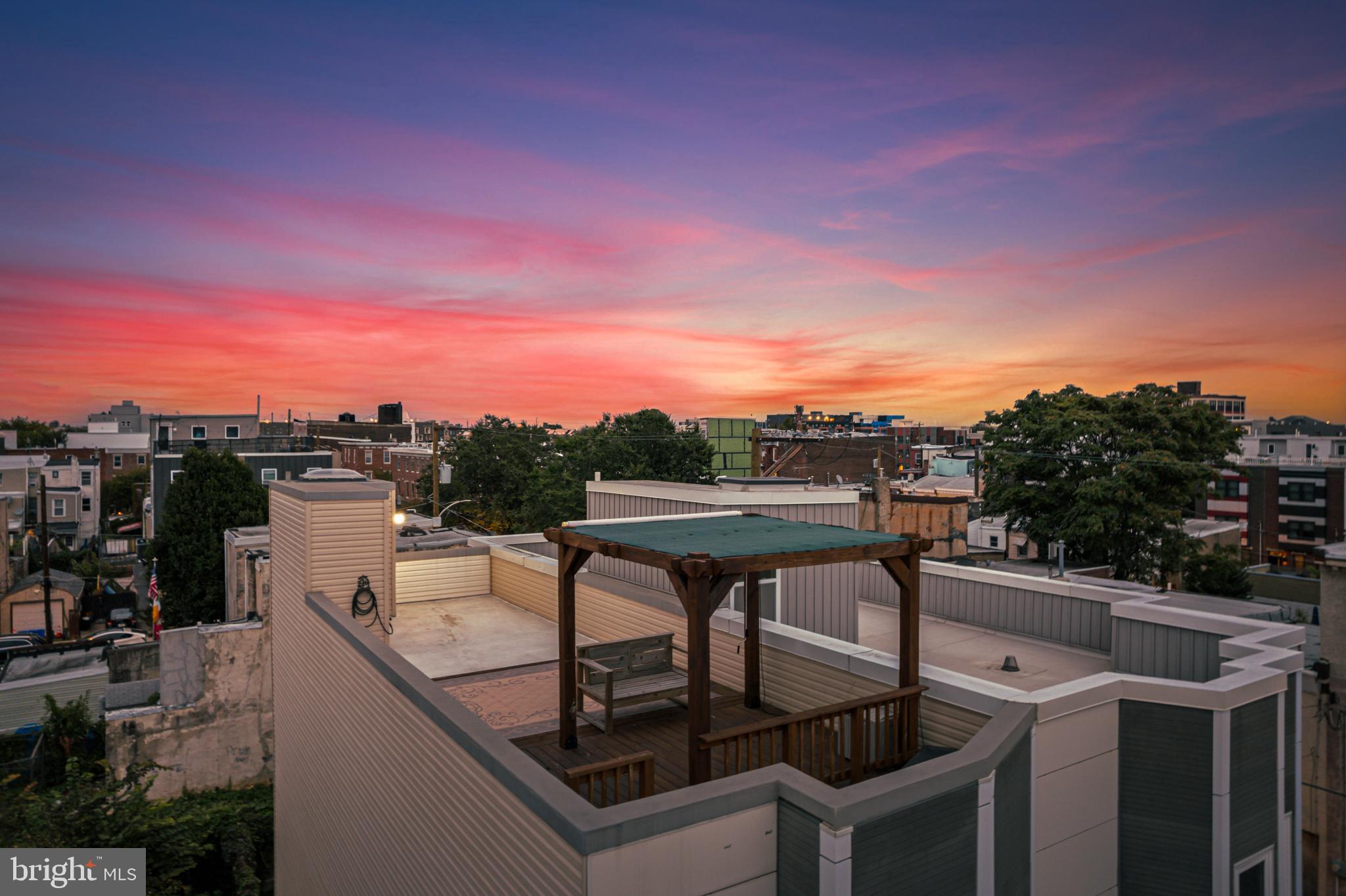 2041 East Sergeant Street Philadelphia, PA 19125 - Photo 37 of 40 Stunning sunset over urban rooftops.