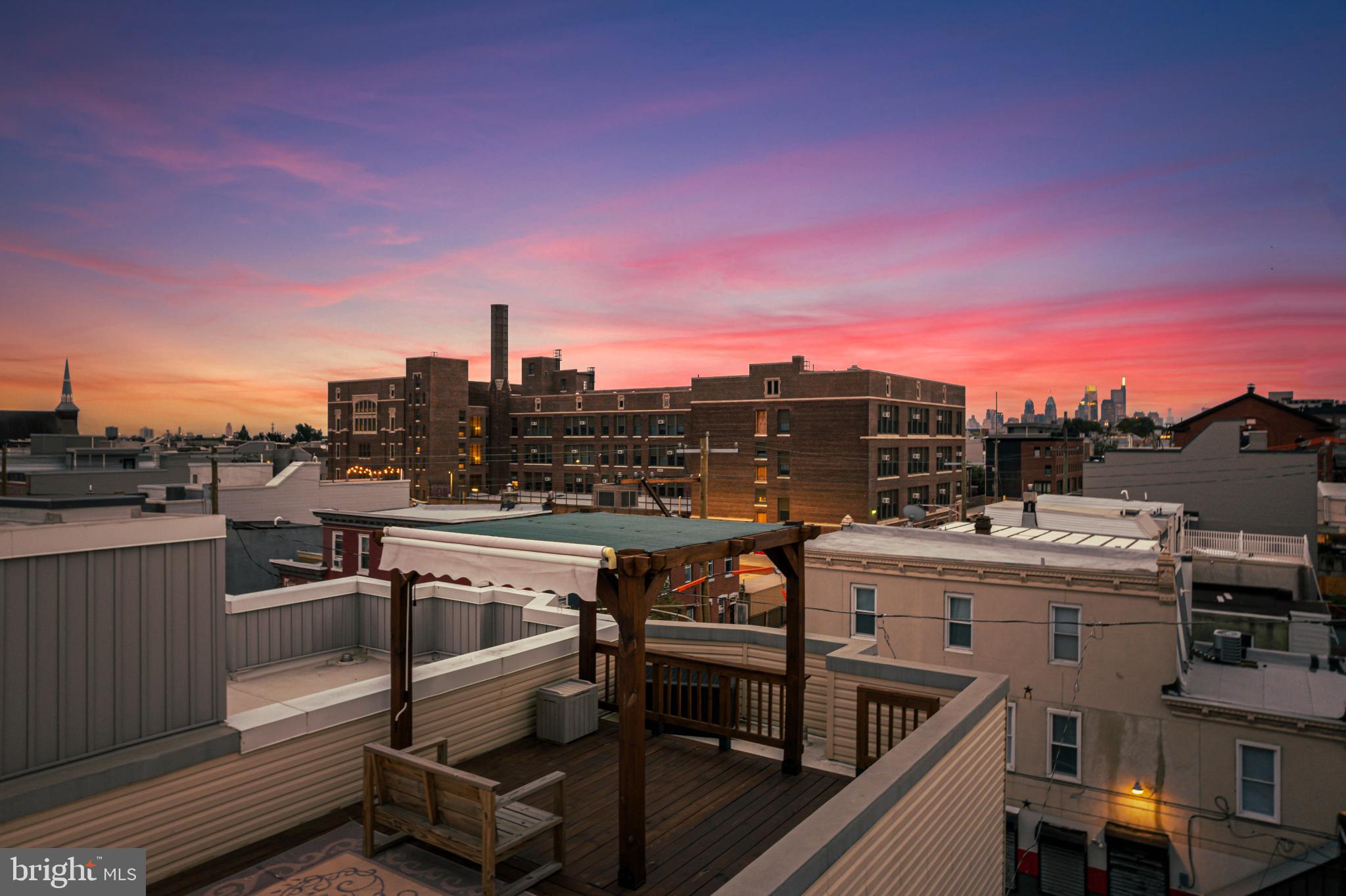 2041 East Sergeant Street Philadelphia, PA 19125 - Photo 38 of 40 Rooftop retreat with vibrant sunset hues.