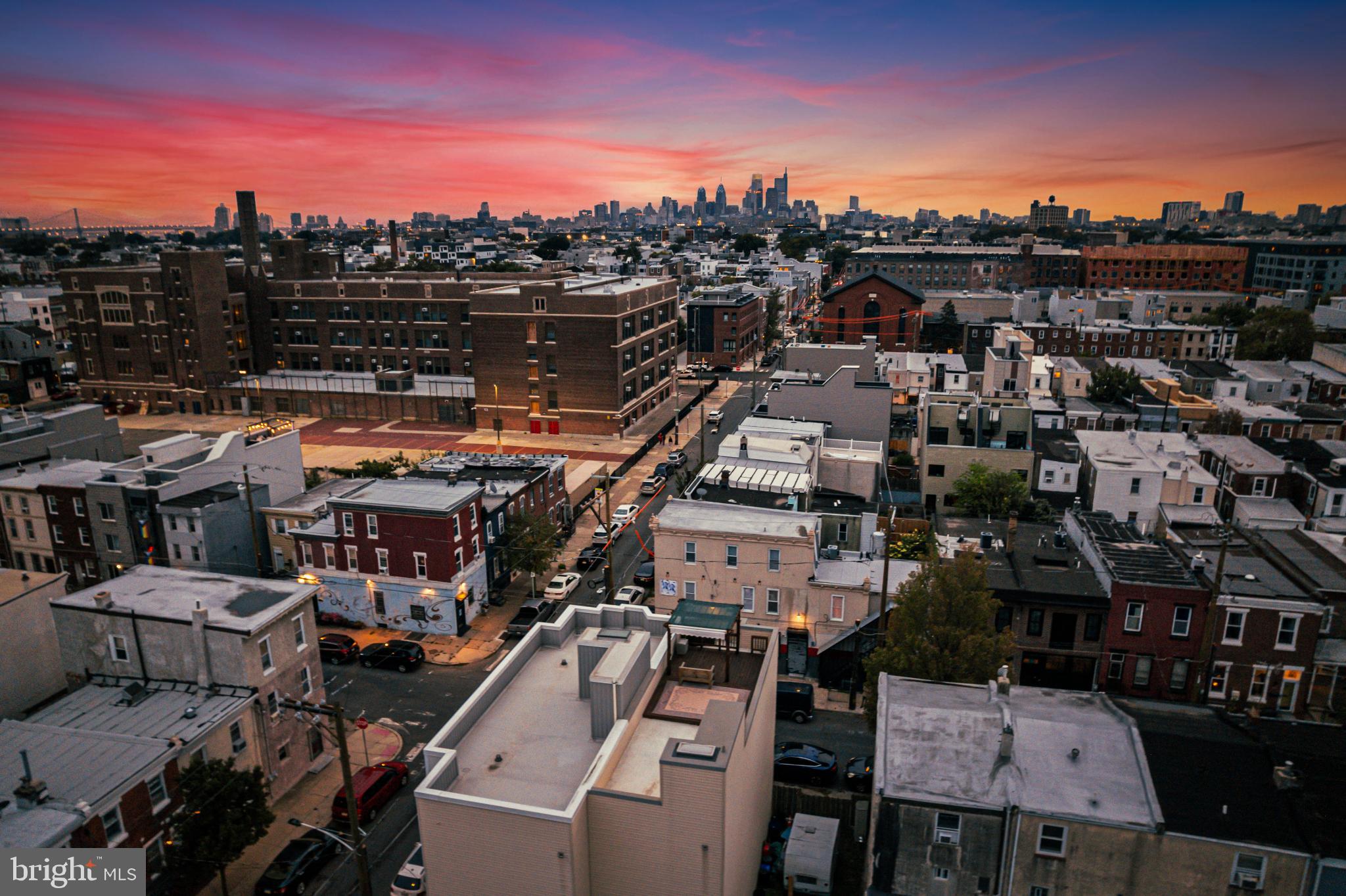 2041 East Sergeant Street Philadelphia, PA 19125 - Photo 39 of 40 Vibrant skyline at dusk over city rooftops.