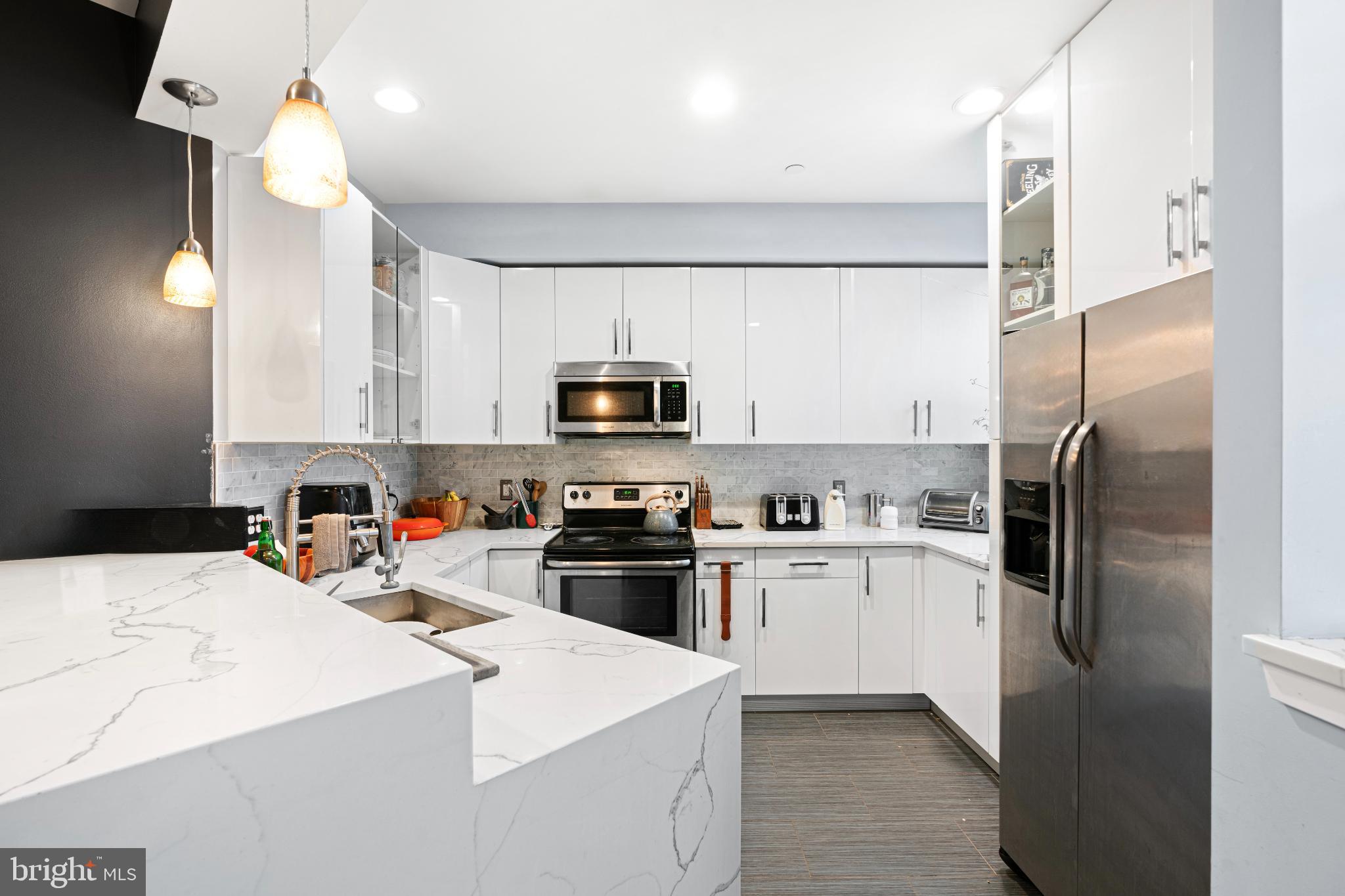 2041 East Sergeant Street Philadelphia, PA 19125 - Photo 8 of 40 Sleek modern kitchen with elegant finishes.