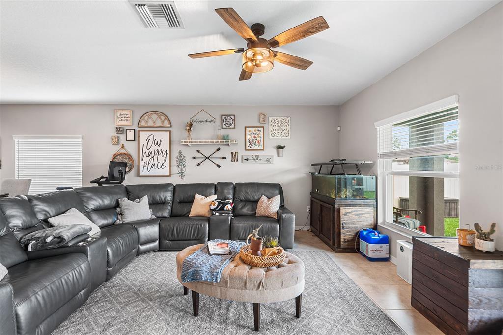 12960 Conquistador Loop Spring Hill, FL 34610 - Photo 12 of 26 a living room with furniture kitchen view and a window
