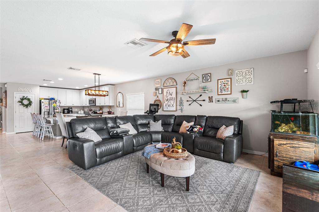 12960 Conquistador Loop Spring Hill, FL 34610 - Photo 13 of 26 a living room with furniture and a breakfast area