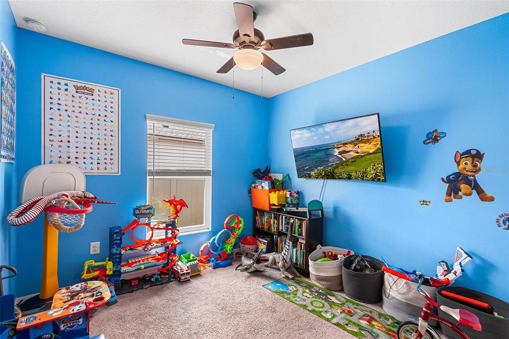 12960 Conquistador Loop Spring Hill, FL 34610 - Photo 20 of 26 a play room with toys