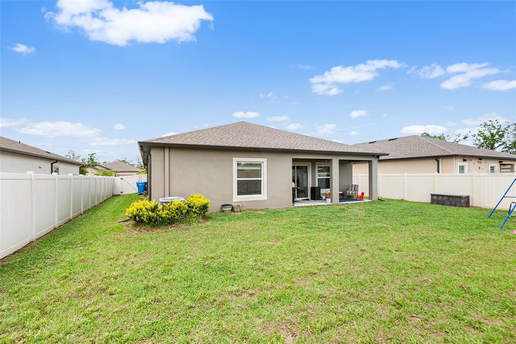 12960 Conquistador Loop Spring Hill, FL 34610 - Photo 24 of 26 a house view with a garden space