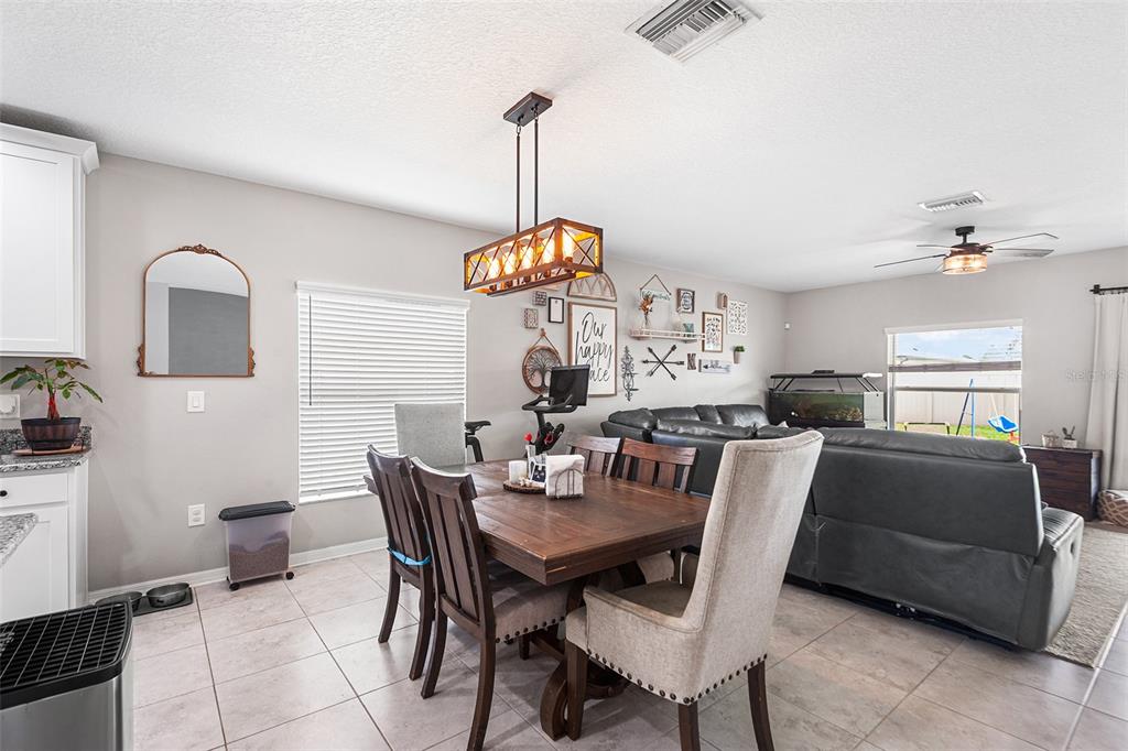 12960 Conquistador Loop Spring Hill, FL 34610 - Photo 10 of 26 a view of a dining room and a livingroom