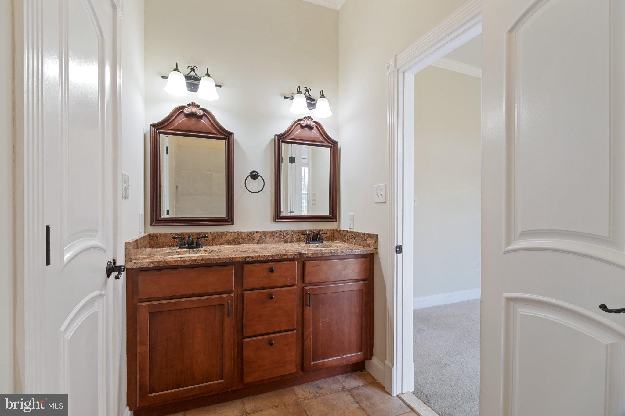 7147 Linganore Road New Market, MD 21774 - Photo 25 of 44 Elegant dual-sink bathroom retreat.