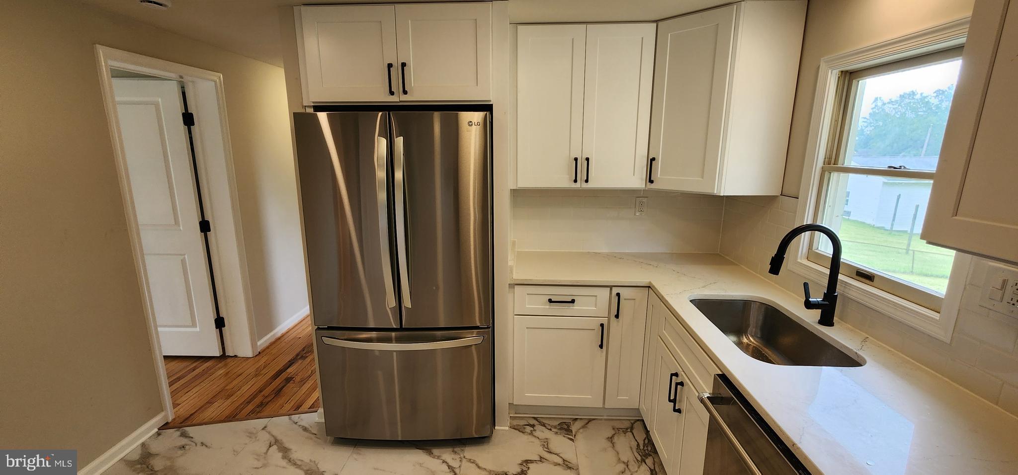 2205 Roth Road Edgewood, MD 21040 - Photo 9 of 35 a kitchen with stainless steel appliances a refrigerator a sink a stove and cabinets