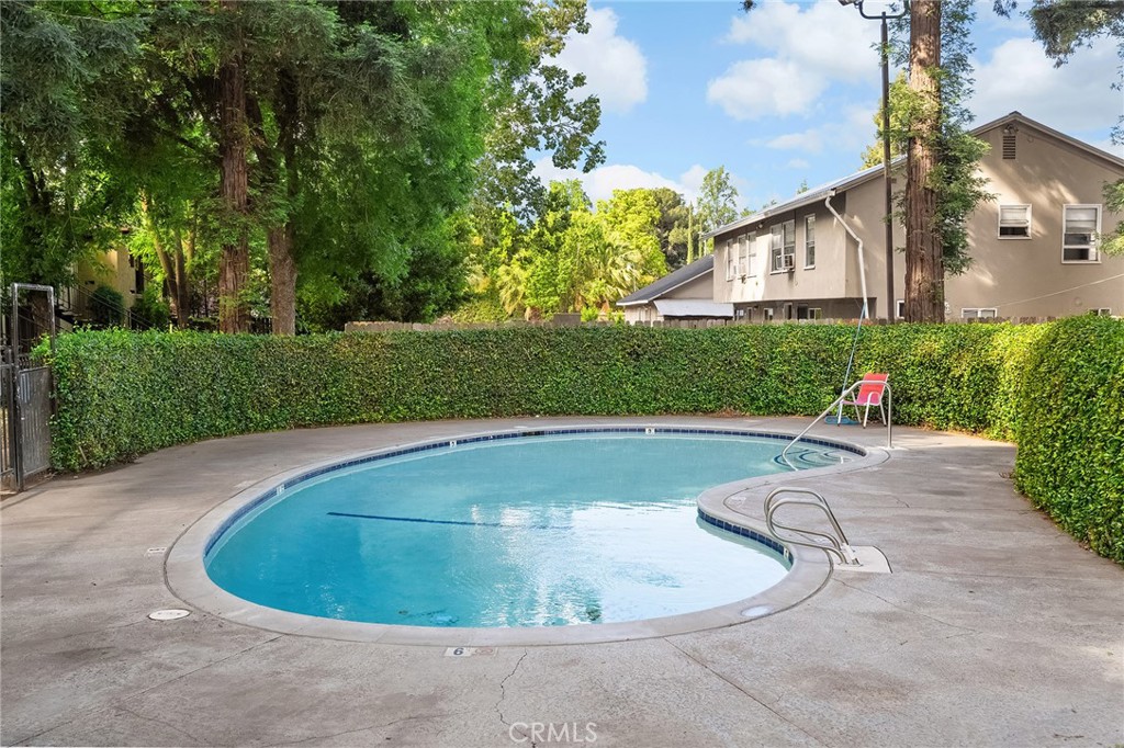 1114 Nord Avenue, Unit 11 Chico, CA 95926 - Photo 11 of 47 a view of a house with swimming pool and garden
