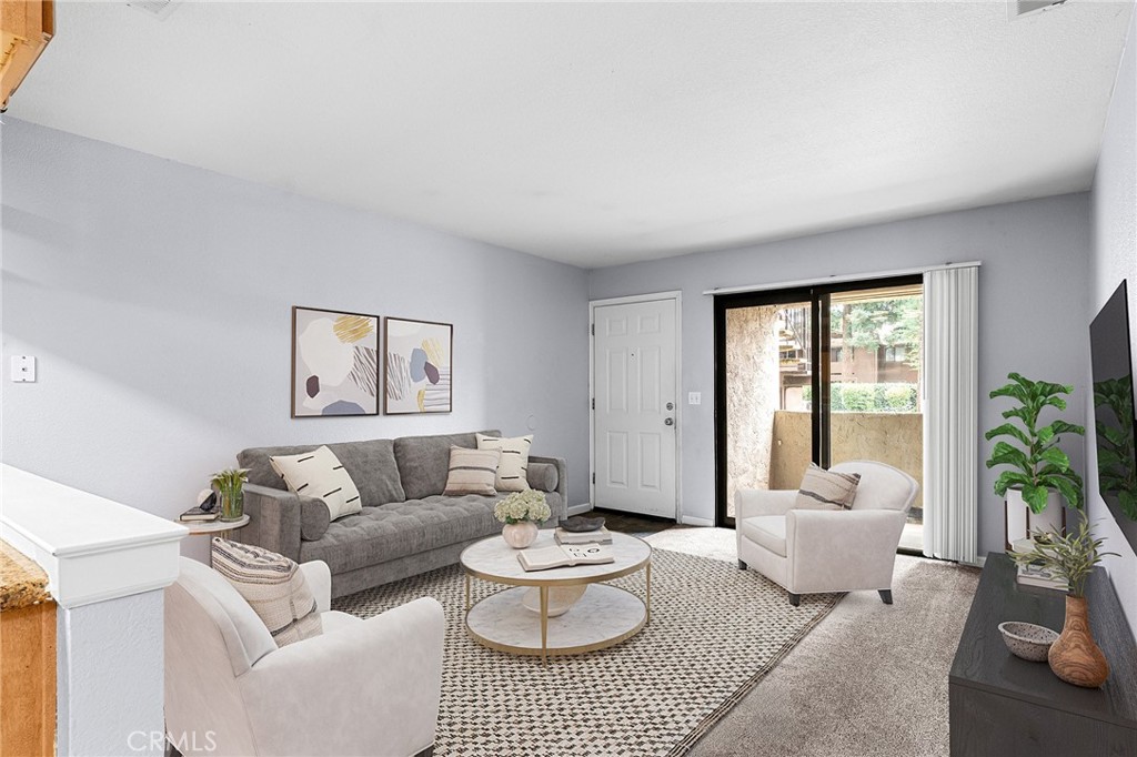 1114 Nord Avenue, Unit 11 Chico, CA 95926 - Photo 2 of 47 a living room with furniture and a large window