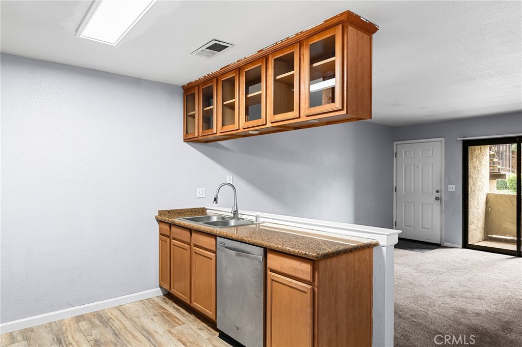 1114 Nord Avenue, Unit 11 Chico, CA 95926 - Photo 29 of 47 a utility room with stainless steel appliances granite countertop a sink and dishwasher