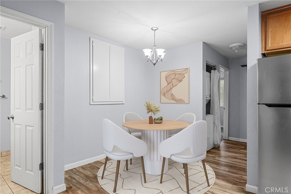 1114 Nord Avenue, Unit 11 Chico, CA 95926 - Photo 3 of 47 a dining room with furniture and window