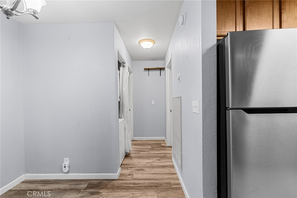 1114 Nord Avenue, Unit 11 Chico, CA 95926 - Photo 31 of 47 a view of a hallway with wooden floor and staircase