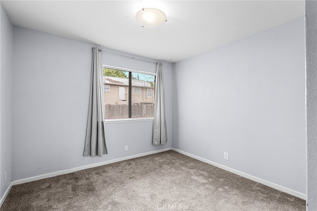 1114 Nord Avenue, Unit 11 Chico, CA 95926 - Photo 32 of 47 an empty room with windows
