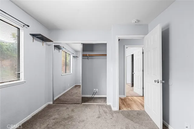 a view of a house with a door and wooden floor