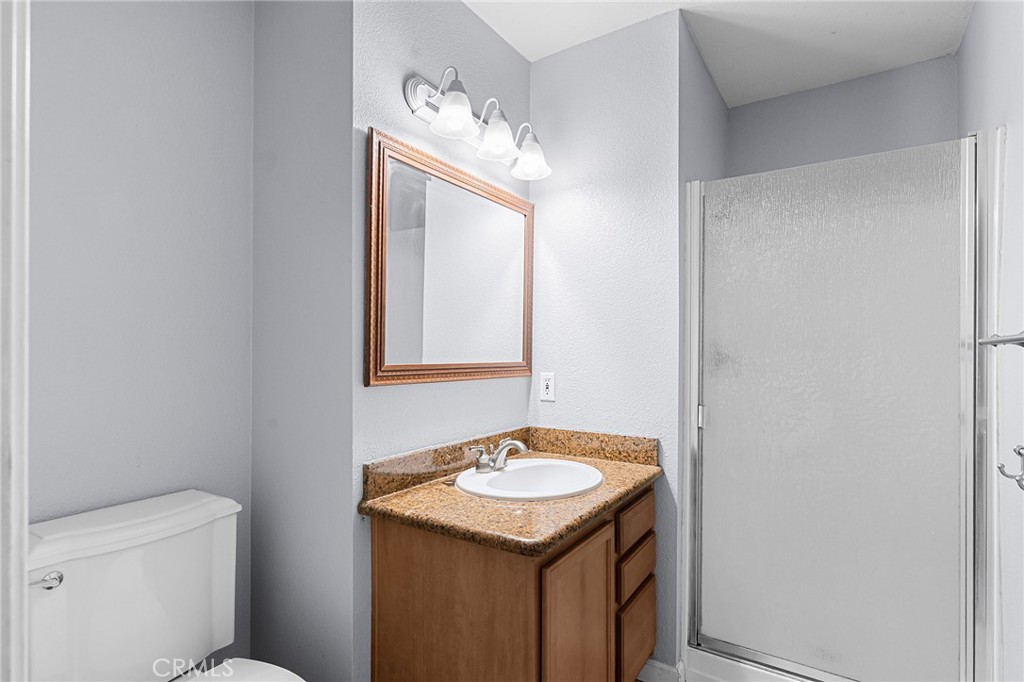 1114 Nord Avenue, Unit 11 Chico, CA 95926 - Photo 40 of 47 a bathroom with a sink toilet and mirror