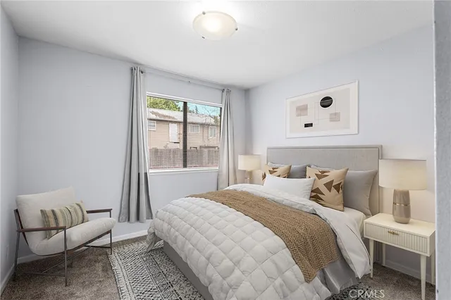 a bedroom with a bed and a couch