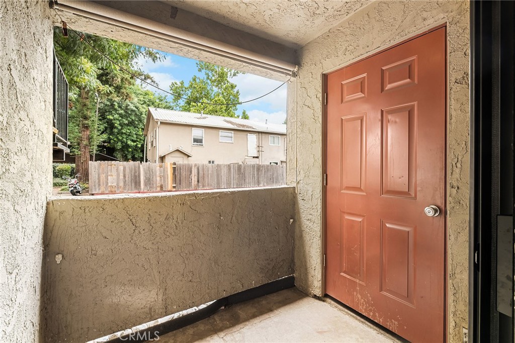1114 Nord Avenue, Unit 11 Chico, CA 95926 - Photo 43 of 47 a view of a house with a door and wooden floor