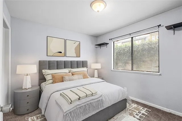 a bedroom with a bed and window