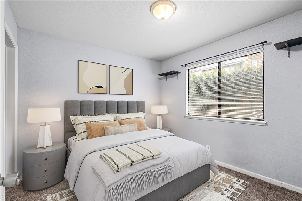 1114 Nord Avenue, Unit 11 Chico, CA 95926 - Photo 5 of 47 a bedroom with a bed and window