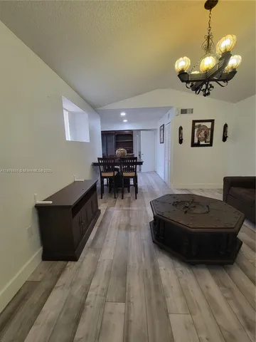 a living room with furniture and a table