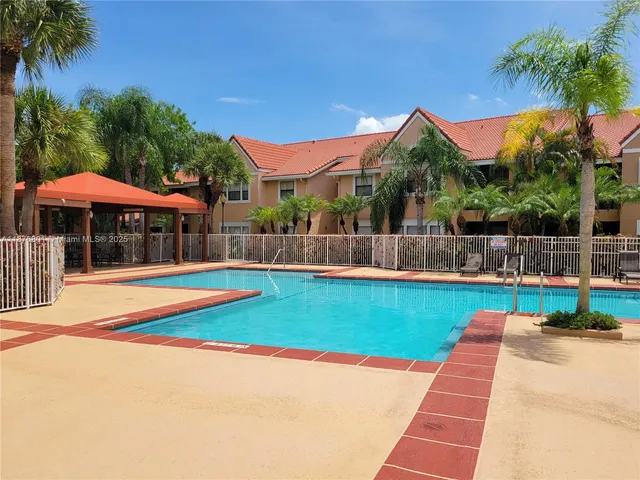 a view of swimming pool with lounge chair