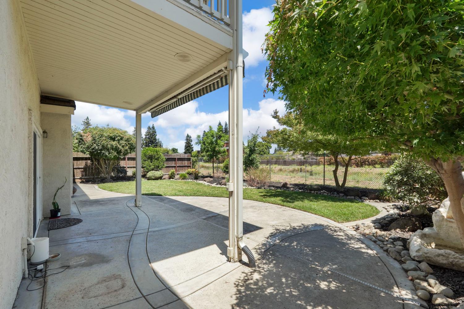 18432 Ironstone Street Woodbridge, CA 95258 - Photo 44 of 50 The backyard feels extra spacious with the canal behind.