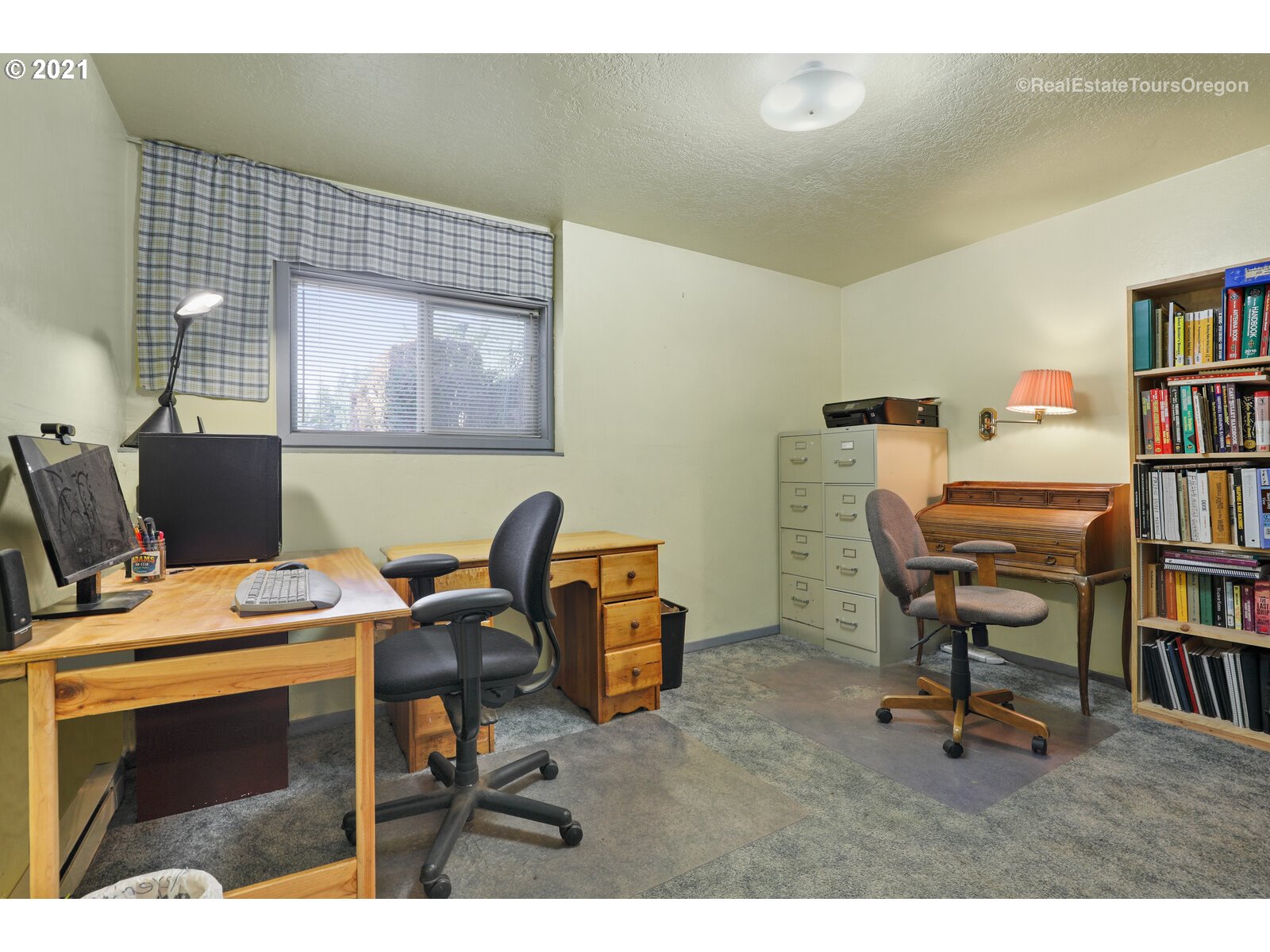 40965 Southwest Vandehey Road Gaston, OR 97119 - Photo 22 of 32 a work room with furniture and a book shelf